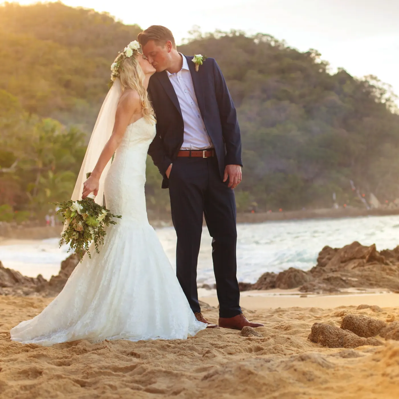 Bride and groom kissing on a Puerto Vallarta beach
